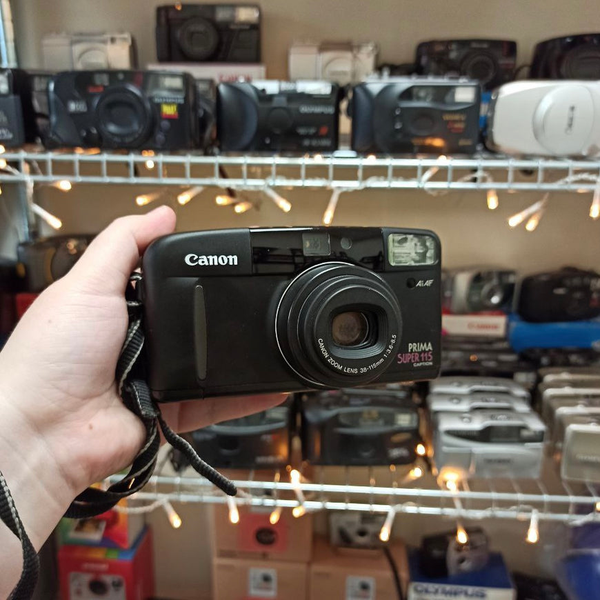 Canon Prima Super 115 Caption черный пленочный фотоаппарат